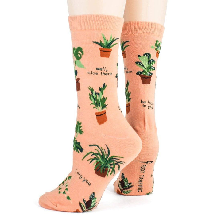 Side view of the plant socks on feet, highlighting "well, aloe there" and "i dig you" puns