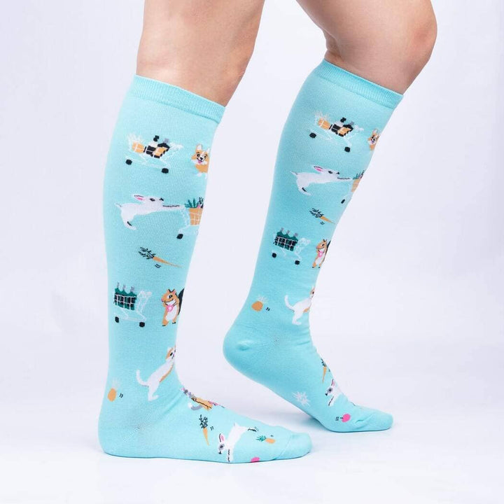 Side view of the shopping animal knee highs worn on legs, showing corgis, bunnies and carts