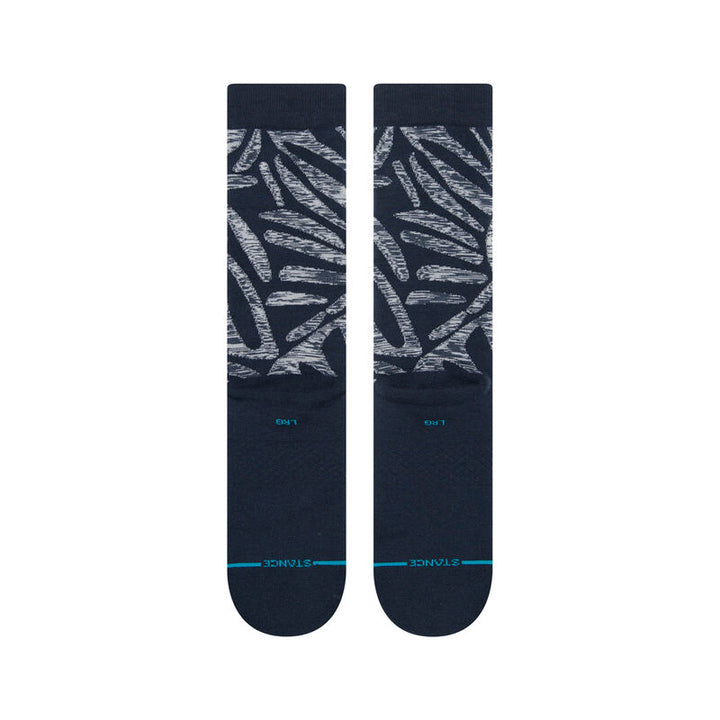 Flat front view of navy Fractalong crew socks with teal toe accent and Stance branding