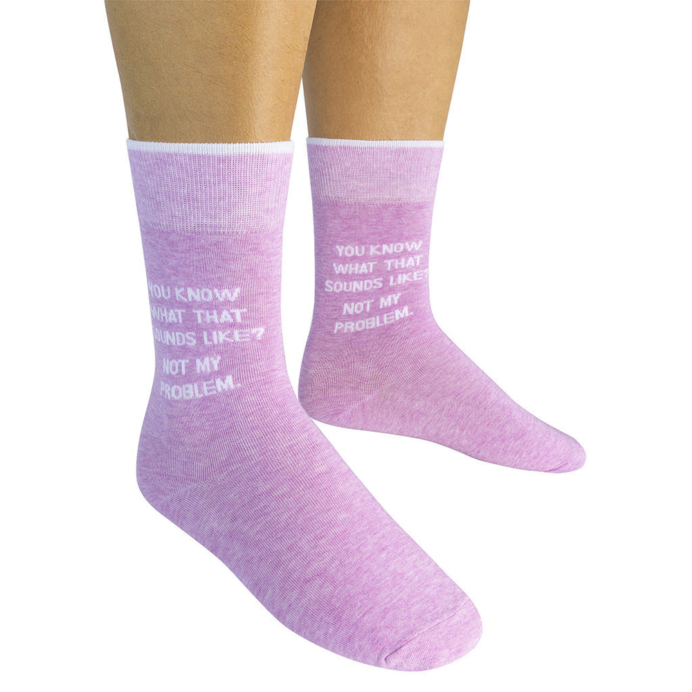 Model wearing the pair of pink Not My Problem crew socks viewed from the front