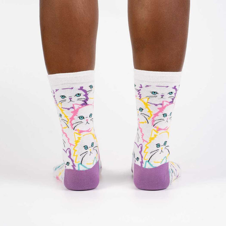 Second back view of the neon cat crew socks worn