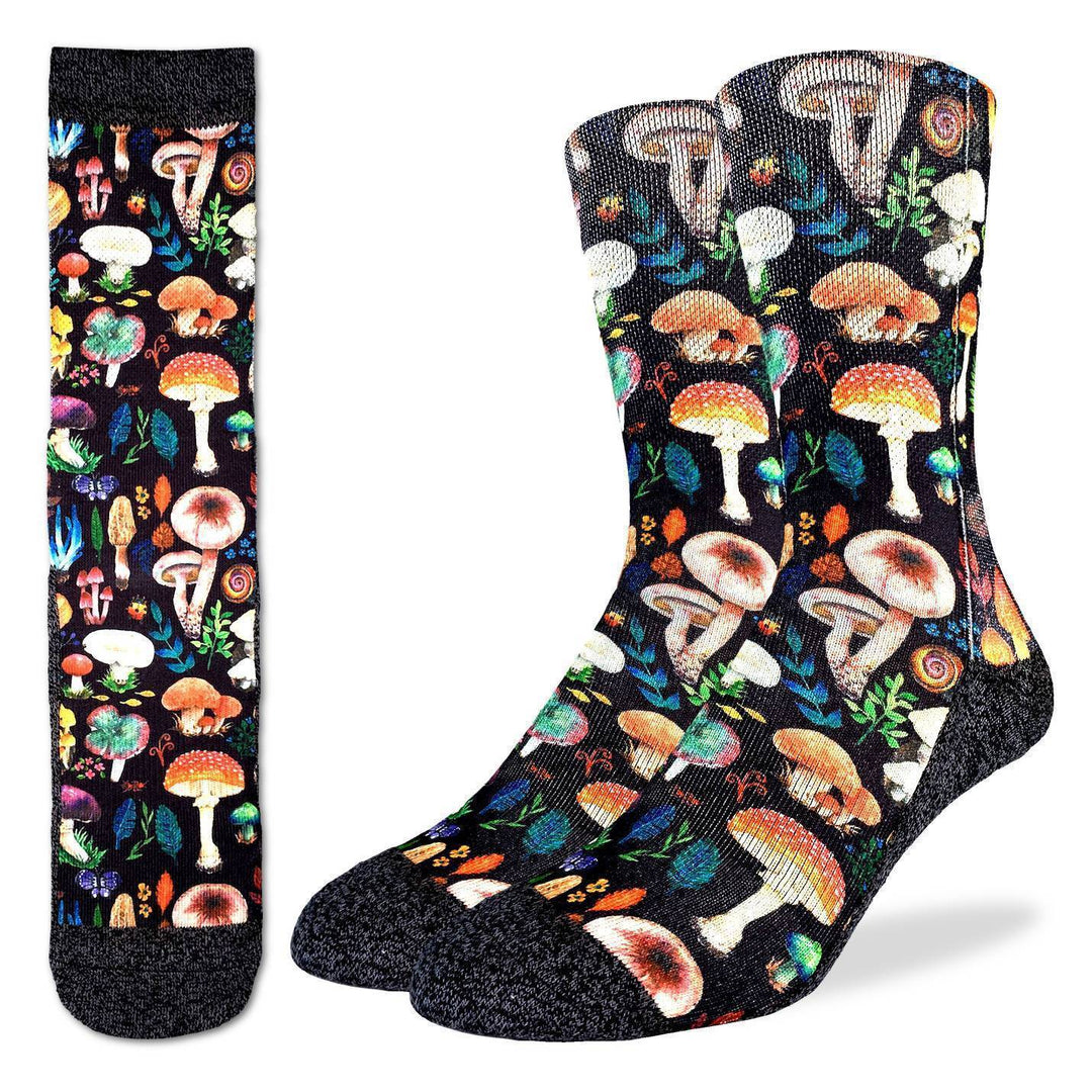Men's mushroom crew socks shown flat and on foot form, covered in colorful toadstools and botanicals on black