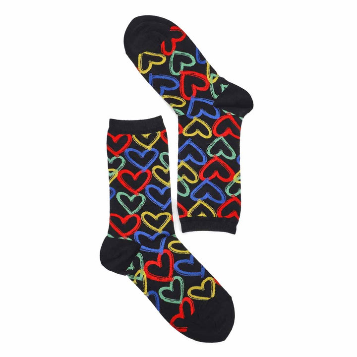 Overhead flat-lay of the graffiti hearts socks, one upright and one folded, showing multicolor hearts on black
