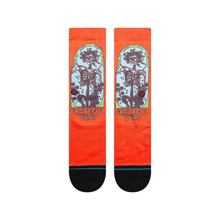 Back view of the red Grateful Dead socks showing the framed Bertha skeleton and roses with black toe