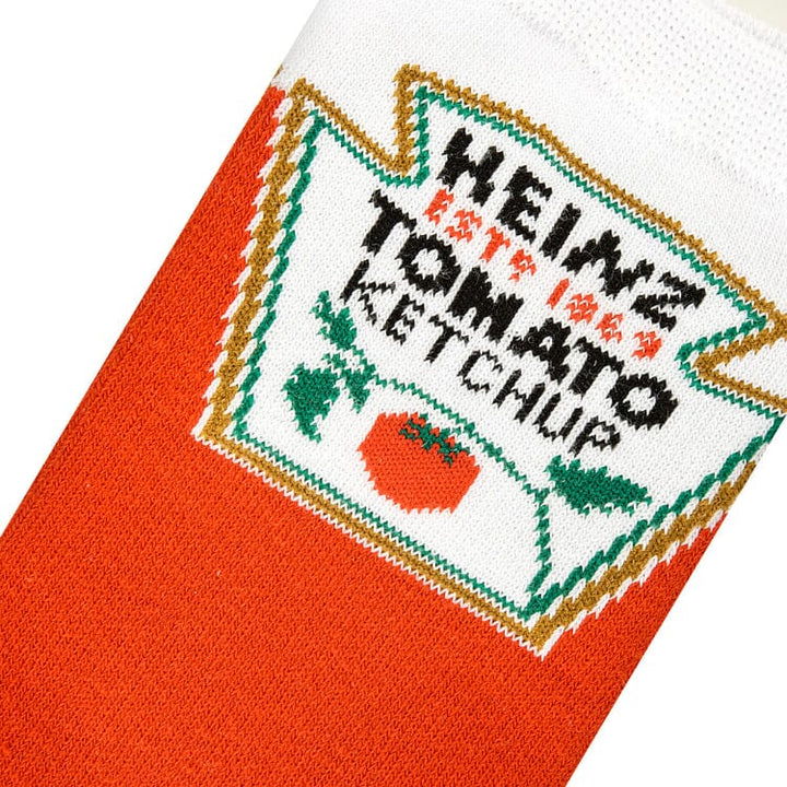 Close-up knit detail of the Heinz Tomato Ketchup label with the tomato graphic