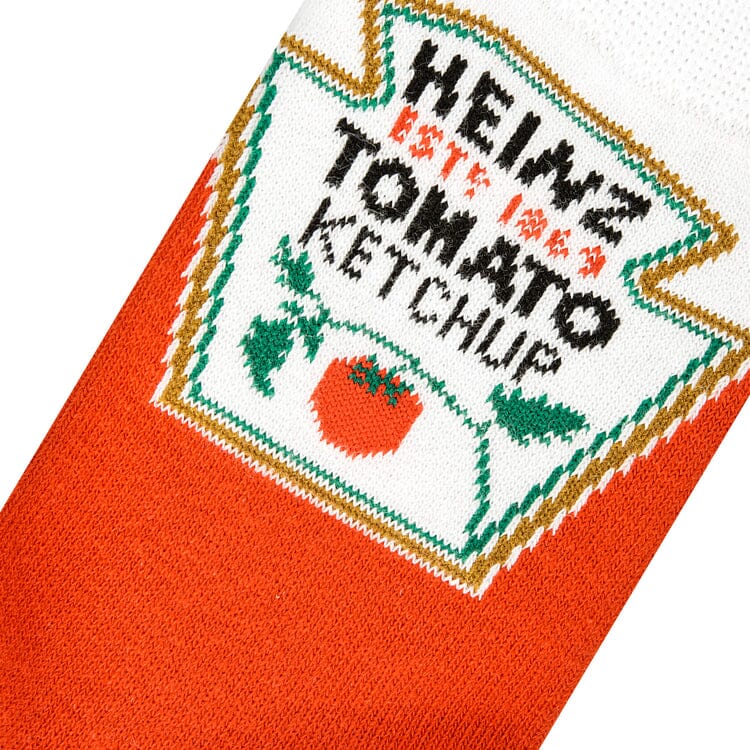 Close-up knit detail of the Heinz Tomato Ketchup label with the tomato graphic