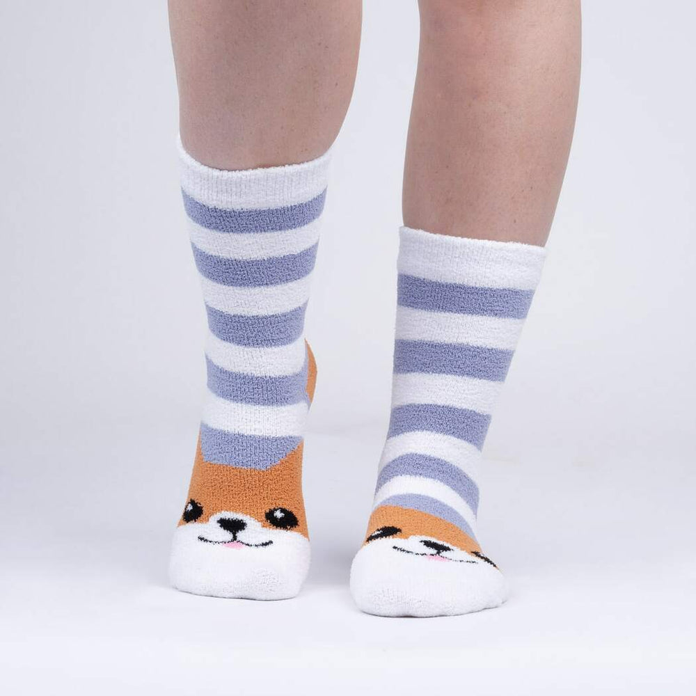 Person wearing the fuzzy corgi striped slipper socks, front view