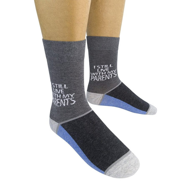 Two gray novelty socks on a model showing the &