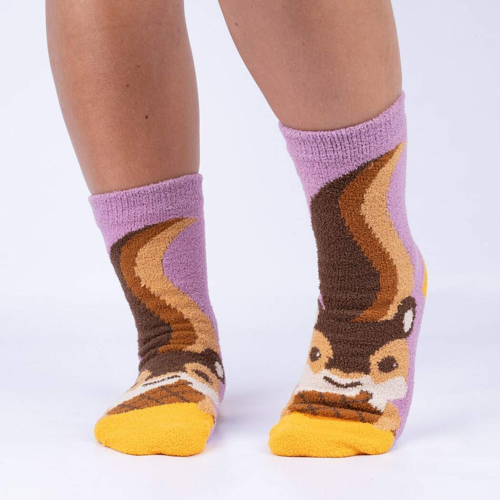 Front view of model wearing the lilac chipmunk slipper socks showing the squirrel face and tail