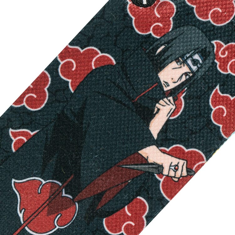 Close-up of Itachi Uchiha holding a kunai amid red Akatsuki clouds on the sock fabric