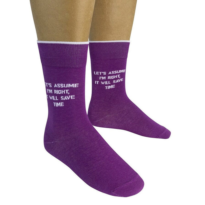Two purple saying socks worn on a model showing the full witty quote
