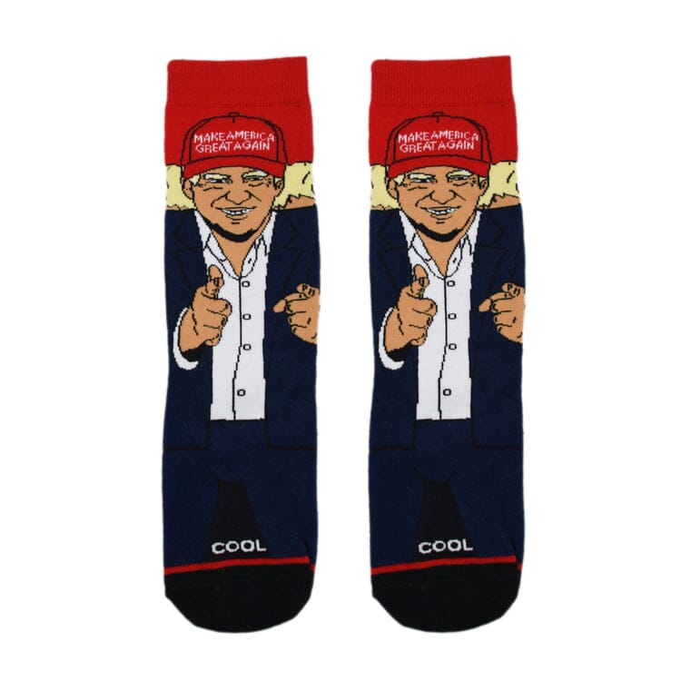 Top-down view of the MAGA caricature crew socks showing the full figure and COOL toe text