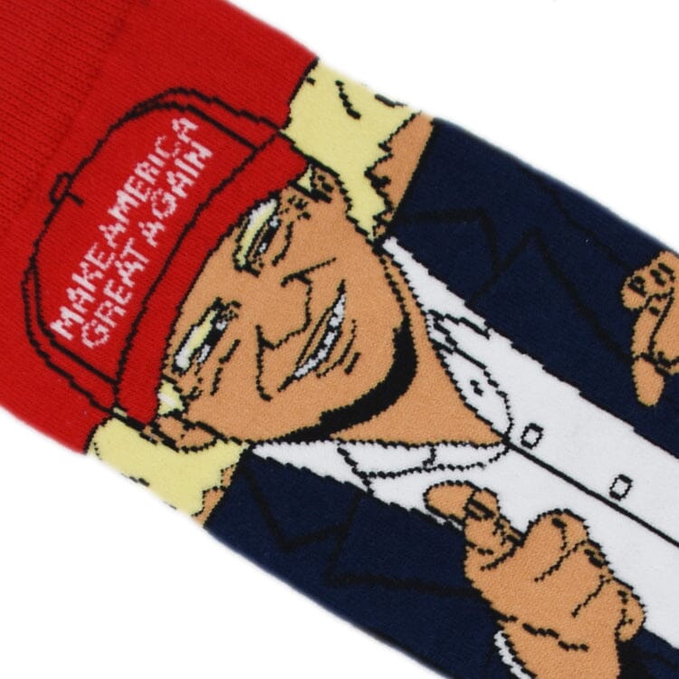 Close-up knit detail of the red Make America Great Again cap and the pointing caricature