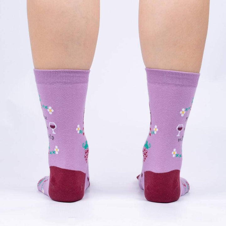 Back view of the wine socks worn on legs, showing the pattern wrapping around the heels
