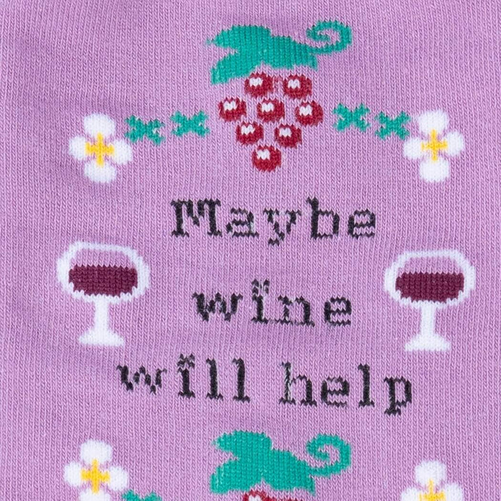 Close-up of the sock detail showing grapes, wine glasses and the &