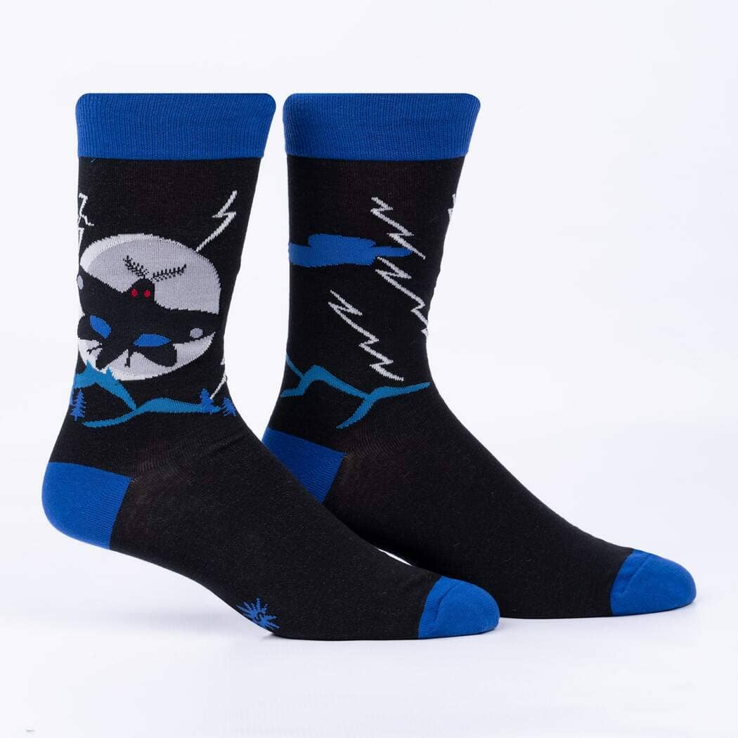 Men's black crew socks with a blue cuff featuring the red-eyed Mothman in front of a grey moon and lightning bolts