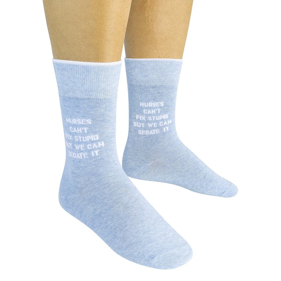 Two heather-blue nurse saying socks worn on a model showing the full quote