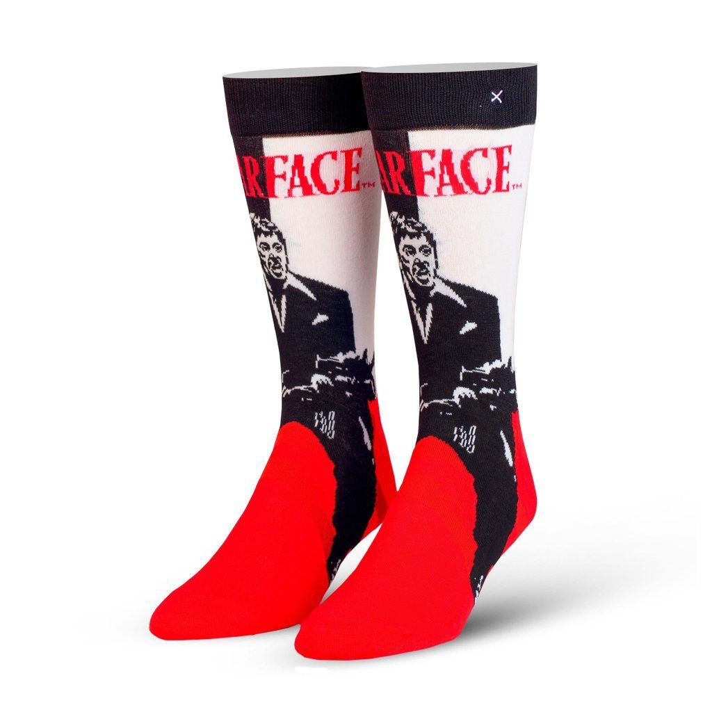 Men's Scarface crew socks displayed as a pair showing the black-and-white Tony Montana poster, red 'Scarface' title, and bright red toes