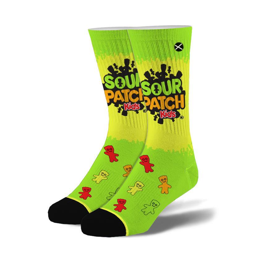 Pair of men's lime-green Sour Patch Kids crew socks with the logo at the cuff, scattered candy characters and black toes