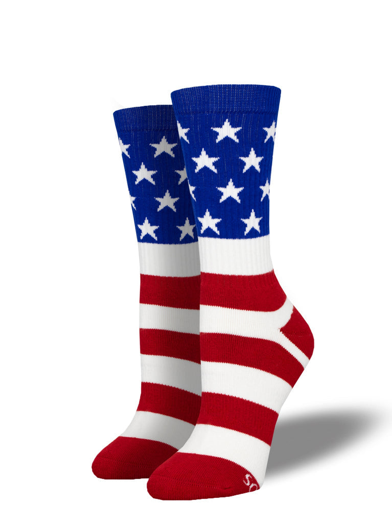 Women's athletic crew socks styled as the American flag, with white stars on a blue cuff above red-and-white stripes