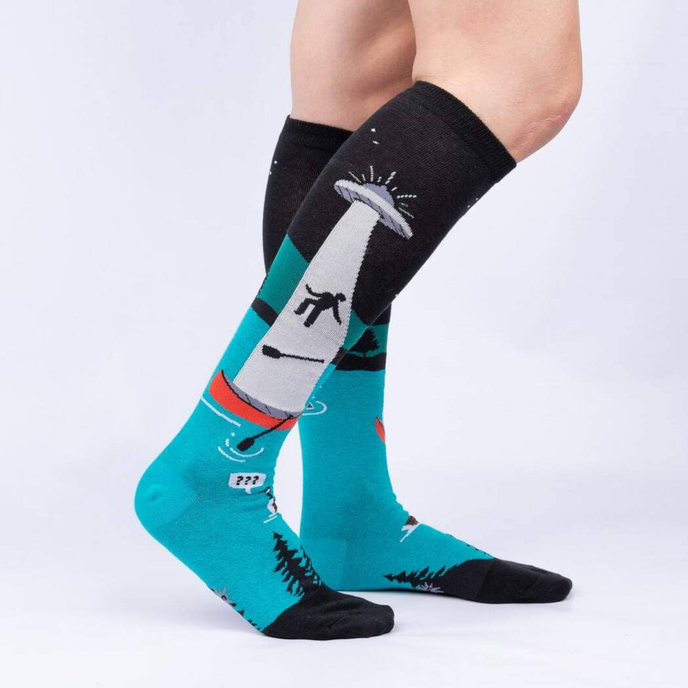 Side view of the UFO knee highs worn on legs, showing the abduction beam and pine treeline