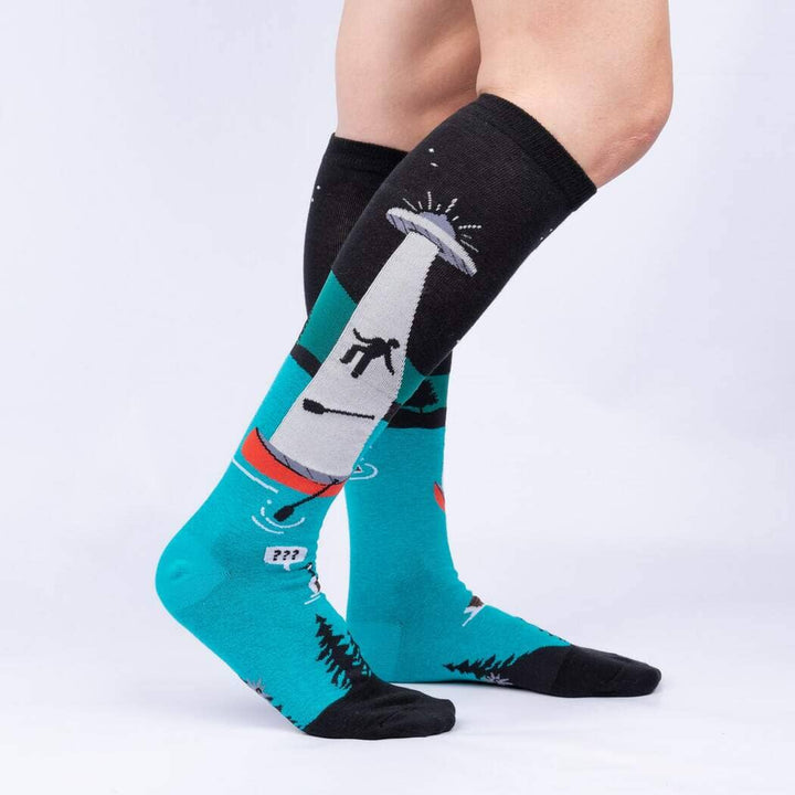 Side view of the UFO knee highs worn on legs, showing the abduction beam and pine treeline