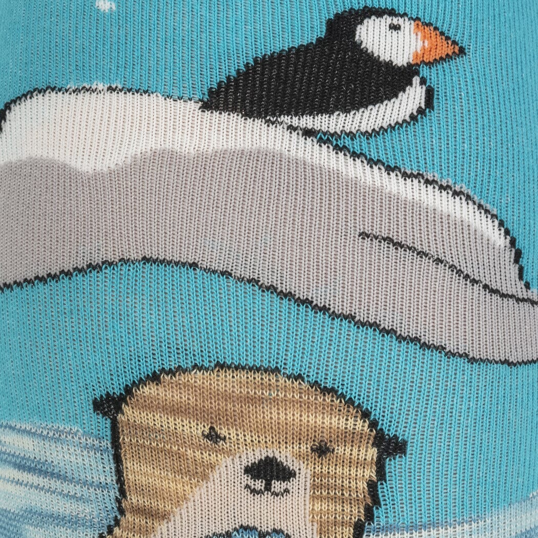 Close-up of the aqua otter sock showing a detailed puffin and a sea otter face in the water
