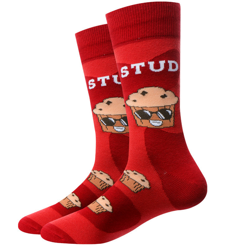 Pair of red Stud Muffin crew socks displayed flat, with STUD lettering and a blueberry muffin wearing sunglasses, smaller muffins near the toes