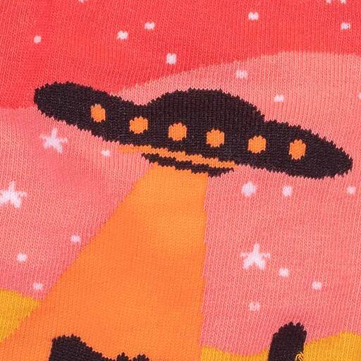 Close-up of the alien socks showing the detailed UFO with glowing beam over a starry pink sky