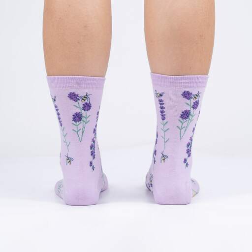 Back view of the lilac lavender crew socks on legs showing lavender sprigs and bees