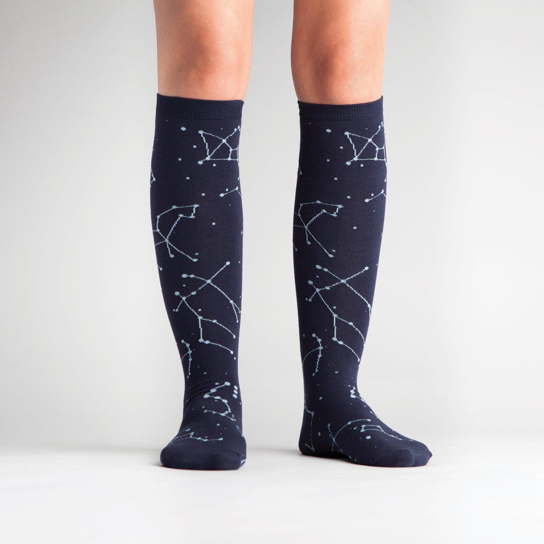 Constellation knee high socks worn on a model, front view