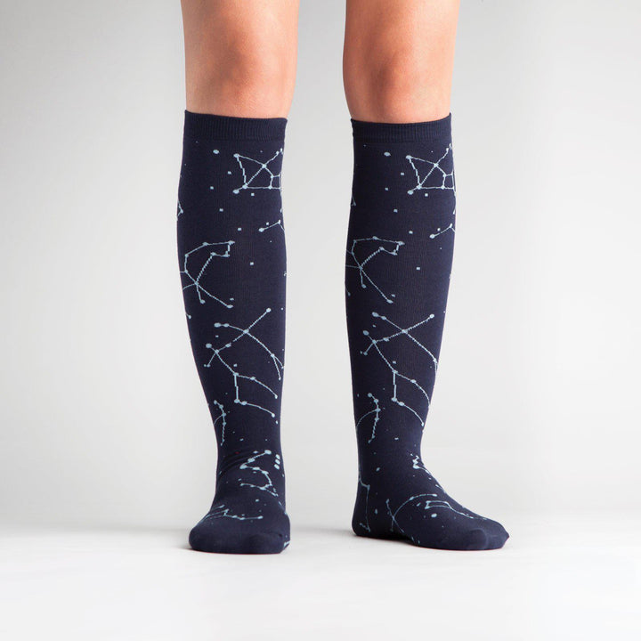 Constellation knee high socks worn on a model, front view
