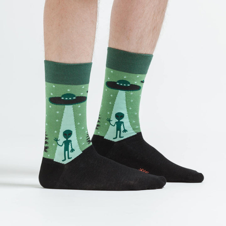 Alien abduction crew socks worn on a model, side view