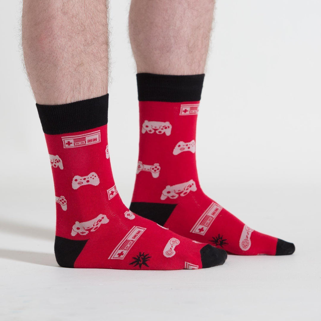 Video game controller crew socks worn on a model, front view
