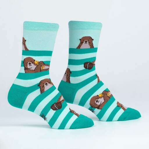 Pair of My Otter Foot crew socks displayed at an angle showing otters and striped teal waves