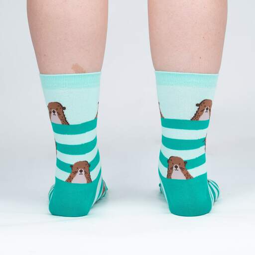 Back view of the teal otter crew socks on legs showing otters between mint and green stripes