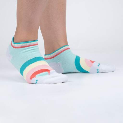 Model wearing mint On Cloud 9 ankle socks with a rainbow and cloud, viewed from the side