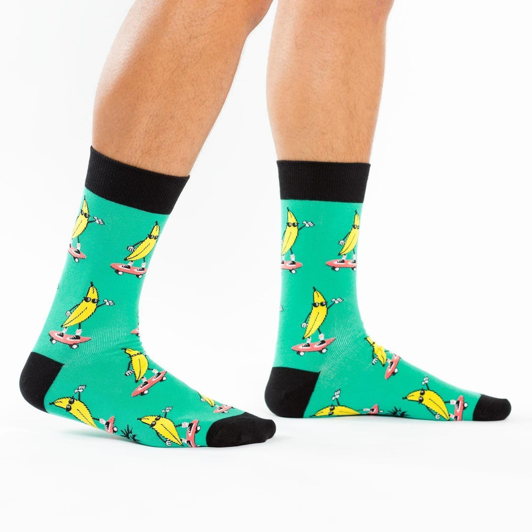 Side view of green banana skateboard crew socks worn on a person&