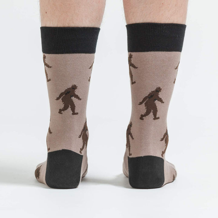 Back view of tan Sasquatch crew socks on a model