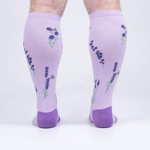 Back view of the lilac lavender knee highs on legs showing lavender sprigs and bees up the calf