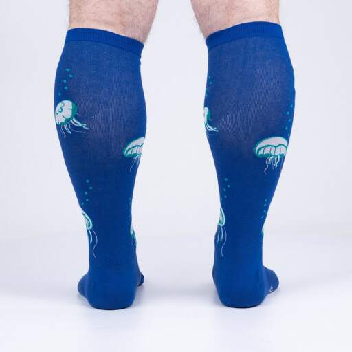 Back view of the blue jellyfish knee highs on legs showing jellyfish drifting up the calf