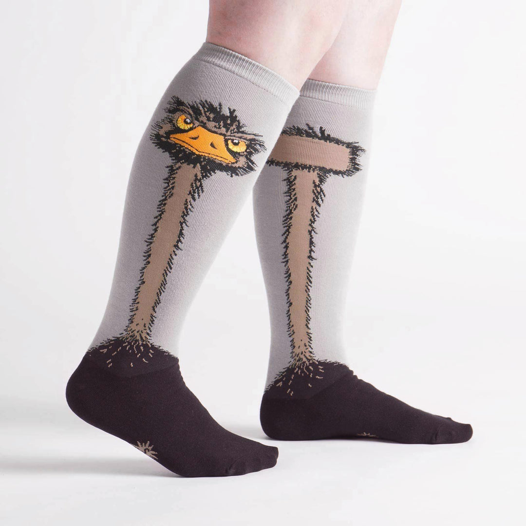 Ostrich knee high socks worn, showing the bird face and long neck down the leg