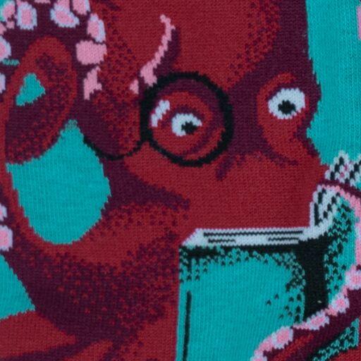Close-up of the same bespectacled reading octopus knit on a teal sock