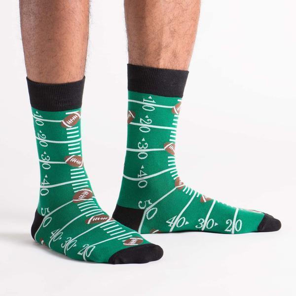 Football field crew socks worn on a model, front view