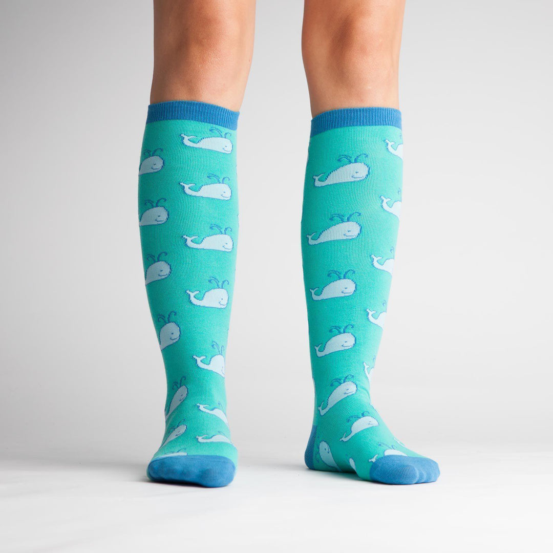 Whale knee high socks worn on a model, front view