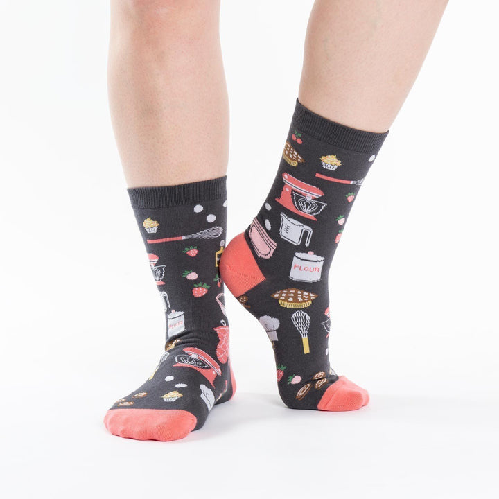 Side view of gray baking crew socks worn on a person&