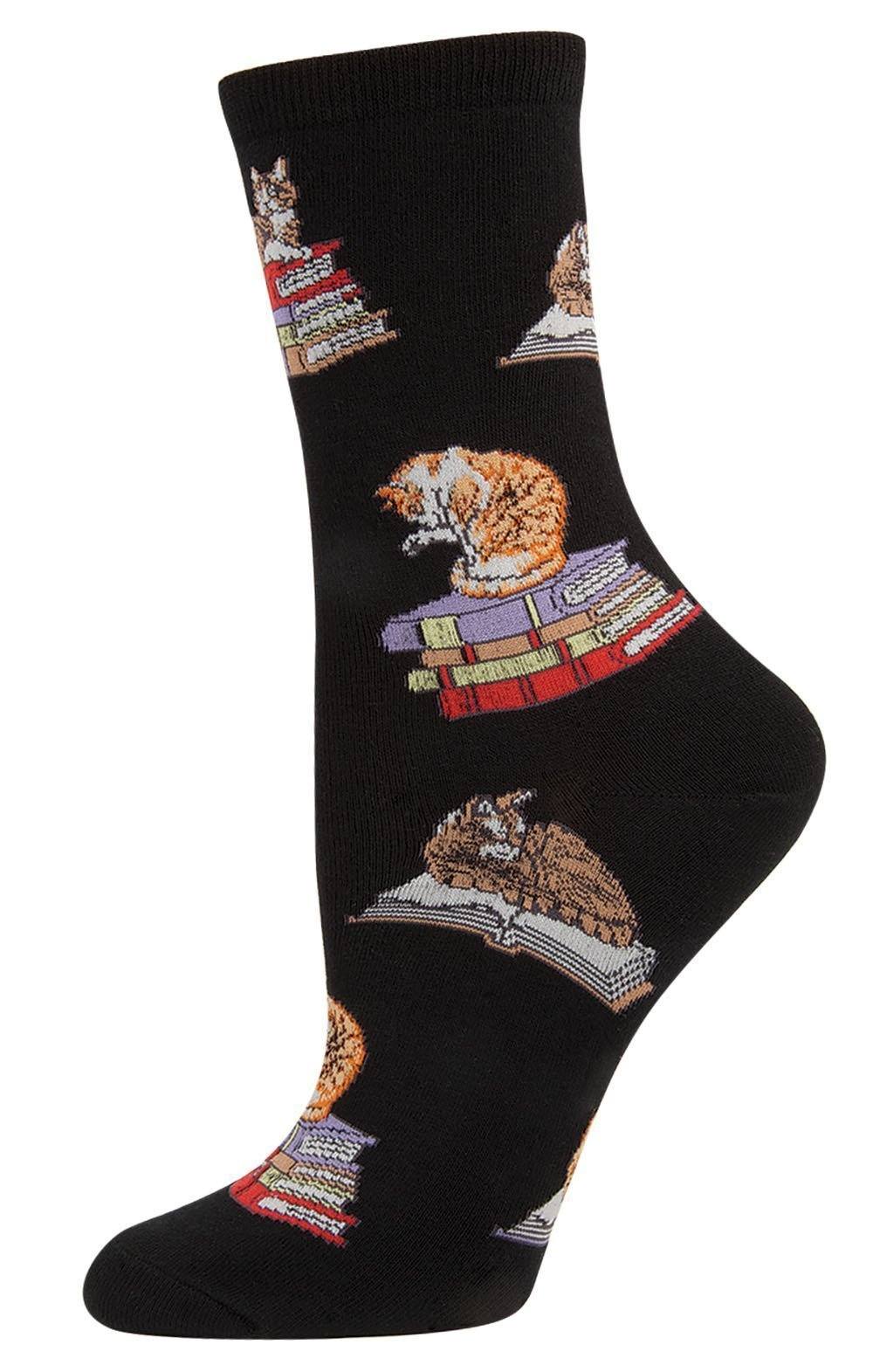 Women's black crew sock with tabby and ginger cats sitting on stacked colorful books