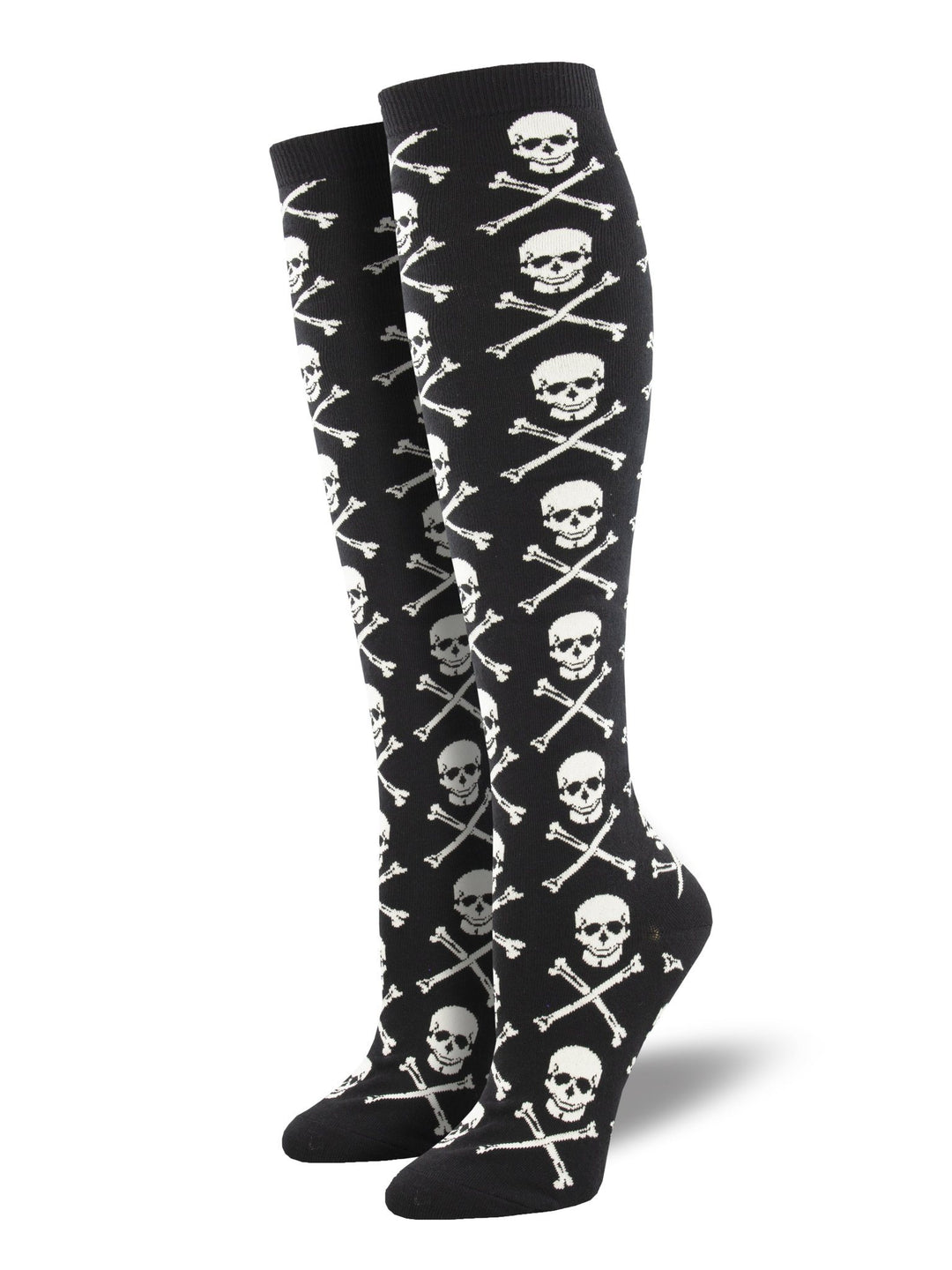 Women's black knee high socks on leg forms, patterned with white skulls and crossbones