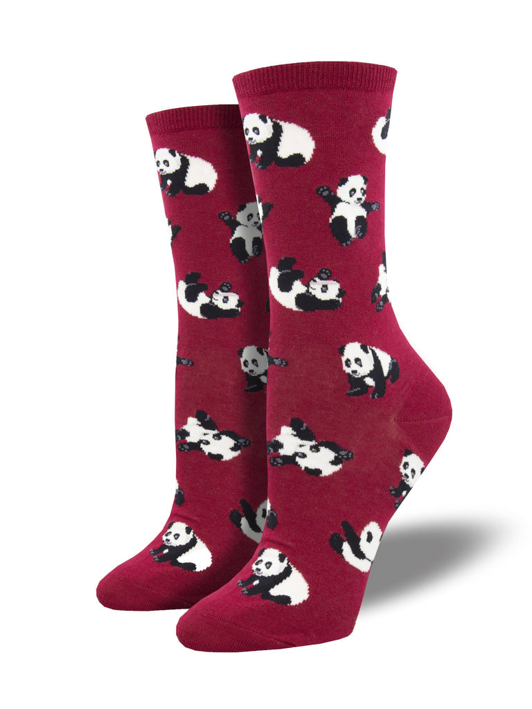 Women's berry-red crew socks on foot forms, patterned with playful black-and-white pandas