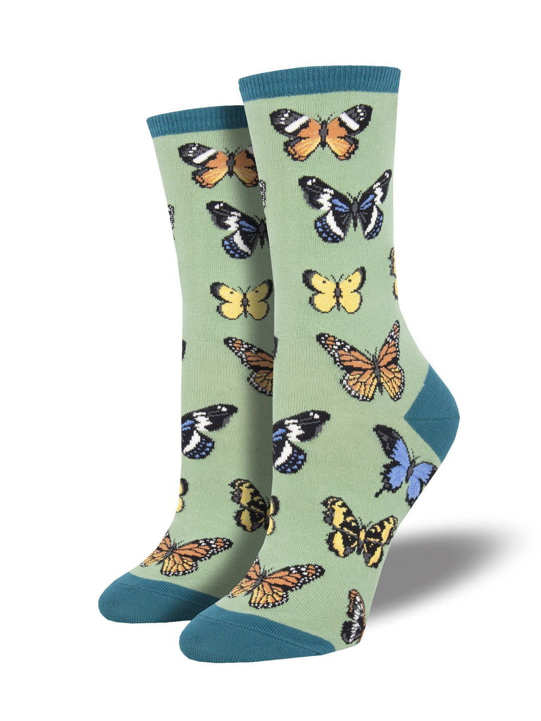 Women's sage green crew socks covered in colorful monarch, swallowtail and blue butterflies with teal cuff, heel and toe